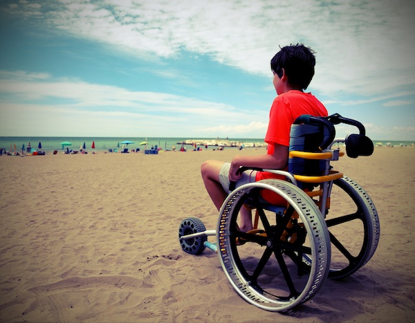 boy on the special wheelchair with aluminum alloy wheels with vi